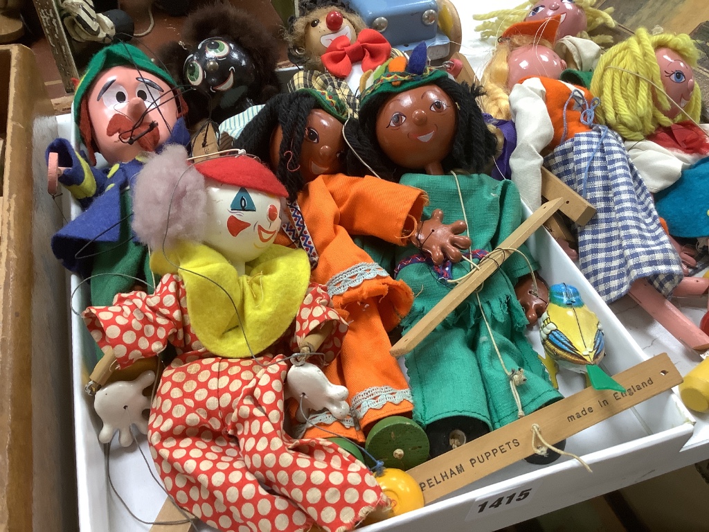 A collection of antique toys, to include a collection of puppets and a toy proscenium theatre